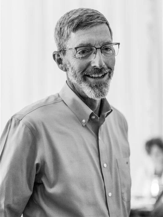CEO John Dwyer looking off camera, smiling.