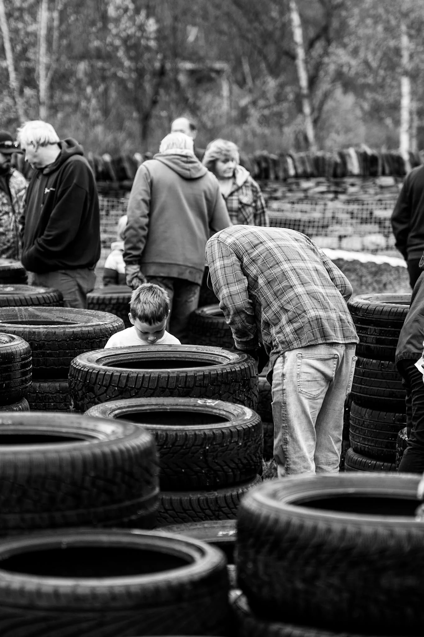 Volunteers sort rows of donated tires at Wheels for Warmth.