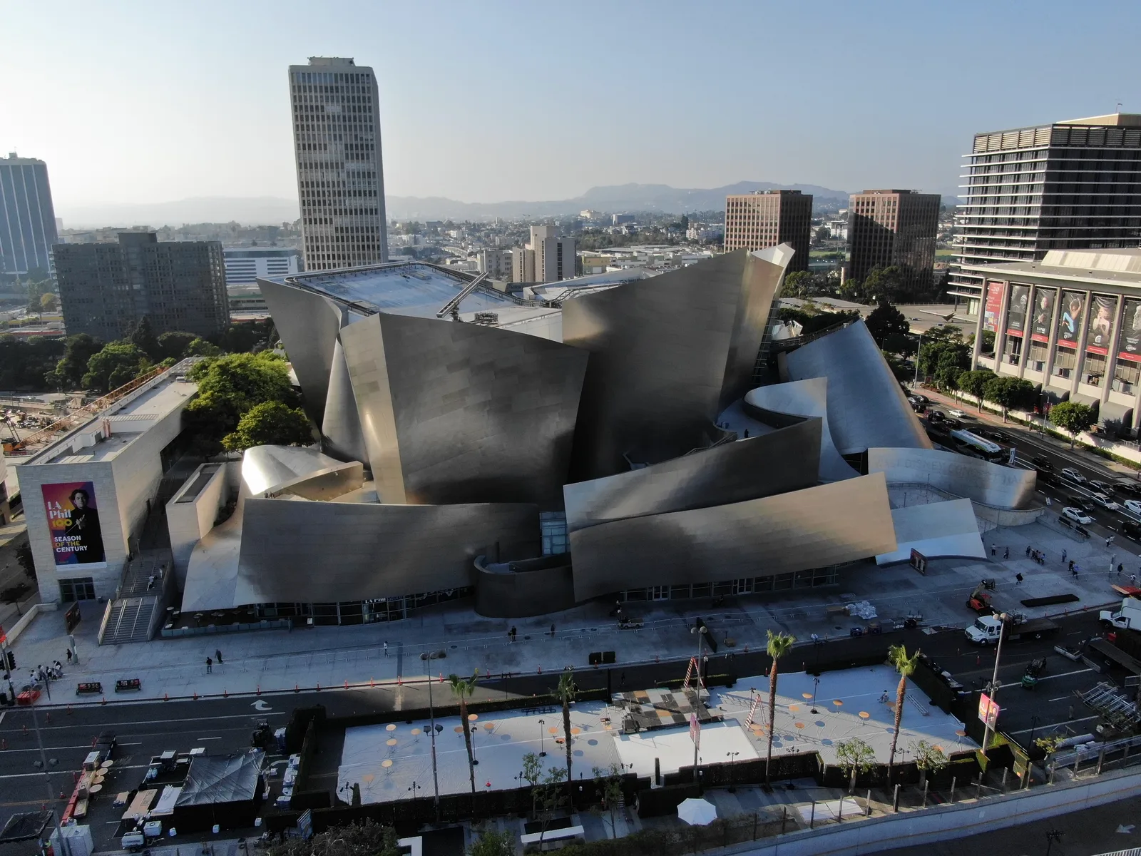 Walt Disney Concert Hall's curved metal roof forms against the Los Angeles skyline