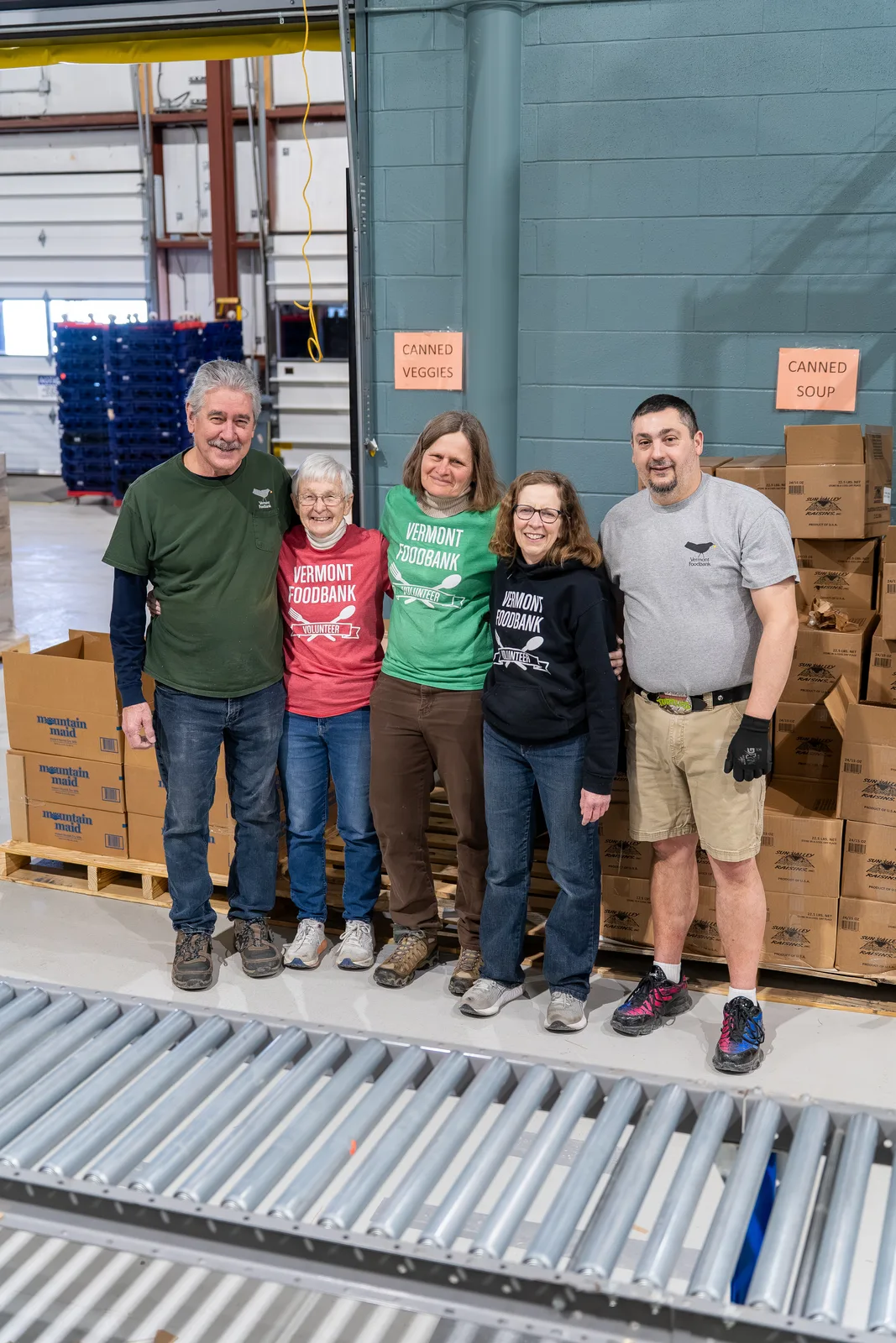 Vermont Foodbank volunteers together in the warehouse